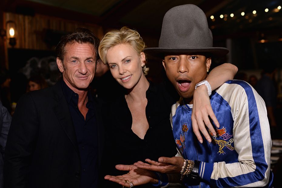 In a vintage hat, Pharrell Williams celebrates his Oscar-nominated single, 