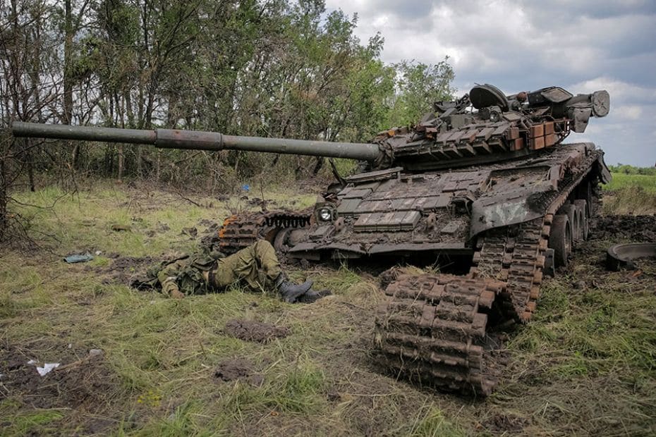 The body of a soldier is seen near a destroyed Russian tank in Donetsk region, Ukraine, June 14, 202