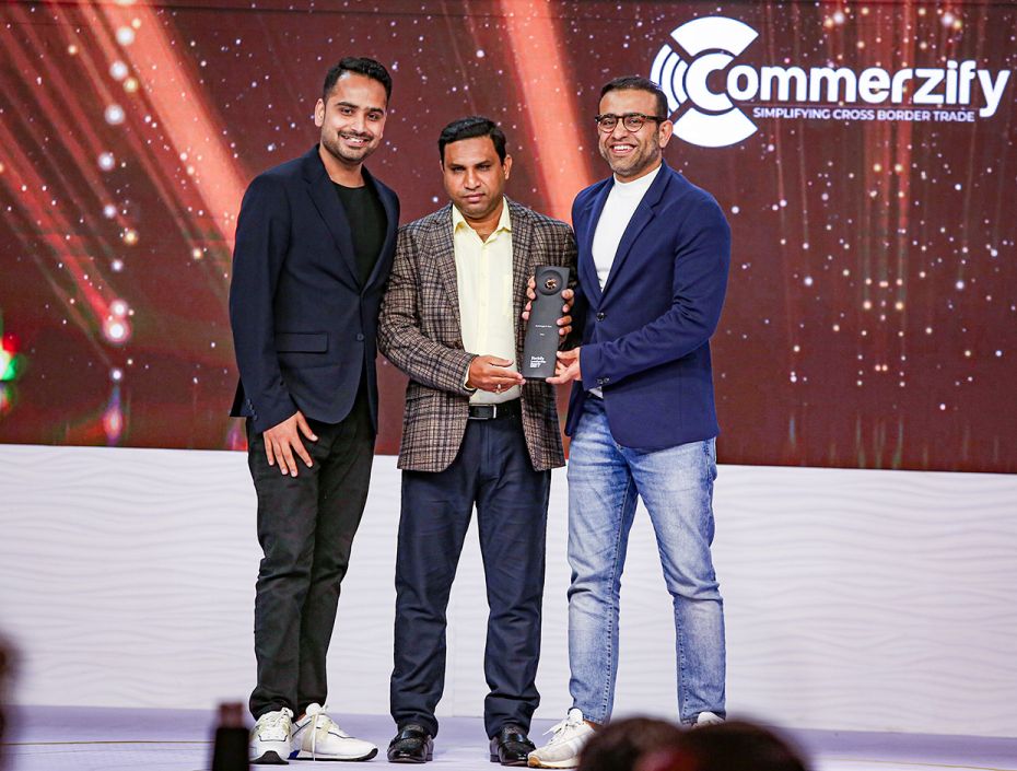 Sudhakar Adapa (centre) of Commerzify presents the Bootstrapped Hero award to Gaurav (left) and Amit